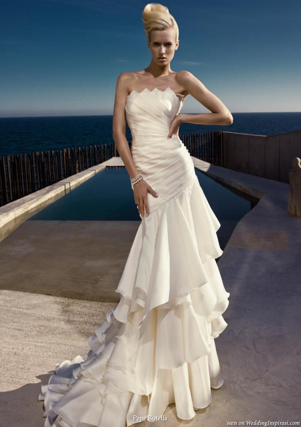Beautiful large ruffle tier strapless wedding gown by Pepe Botella Novias