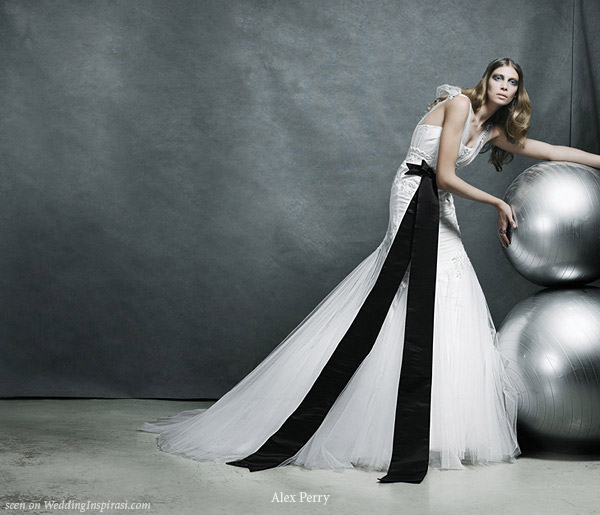 Wedding gown with large black bow detail designed by Alex Perry