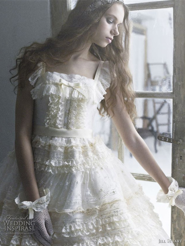 Ivory yellow frilly ball gown with thick lace strap and gloves