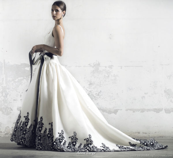white wedding dress with black accents.  stunning white wedding gown with contrasting black hem accents and sash