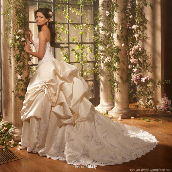 Strapless wedding dress with bustle at the back of the skirt and a short