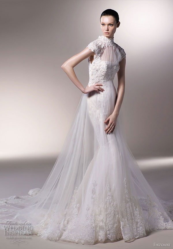 Illusion cap sleeves over a slight sweetheart neckline with lace