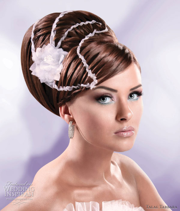 Wedding updo - this elegant look is suitable for brides going for the traditional, Princess or Fairytale romance look