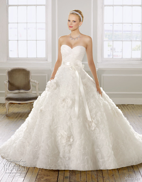 Above very pretty organza wedding dress with floral design ribbon waist