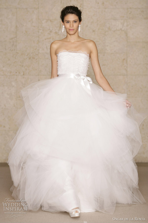 Above white scalloped lace and tulle embroidered ball gown wedding dress