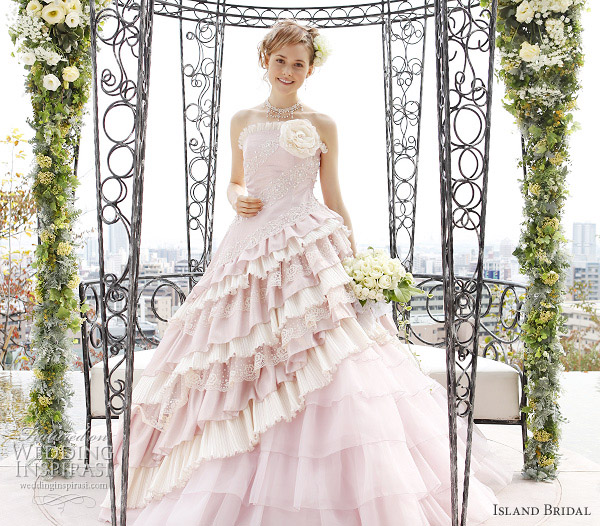 Baby pink strapless wedding gown with asymmetical ruffles