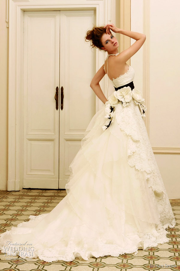 The back of this dress with black sash is stunning White wedding gown by 