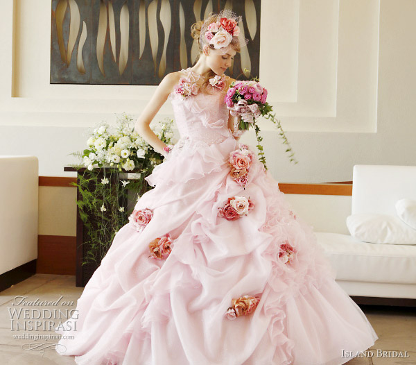 Pick up skirt ball gown wedding dress with darker pink rose accents by Island Bridal