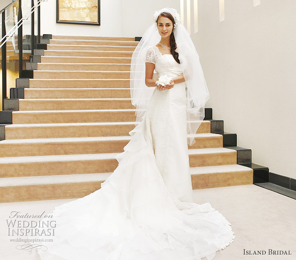 Short sleeve wedding dress with long train by Island Bridal