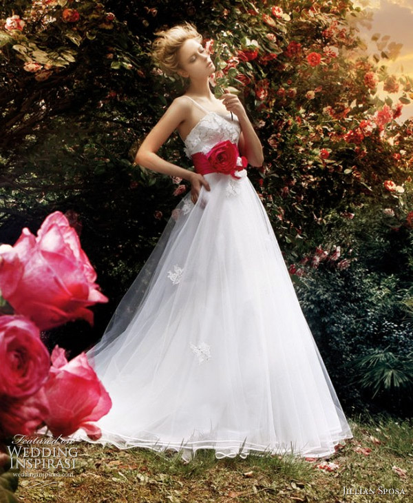 Wedding gown with red sash belt photo shoot in garden of roses
