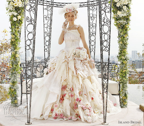 White wedding dress with pink flower accents