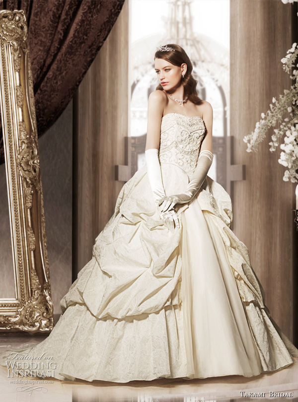  gown featuring tiered bell sleeves below strapless gown with 
