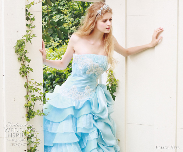 Blue strapless gown adorned with white lace applique on the bodice