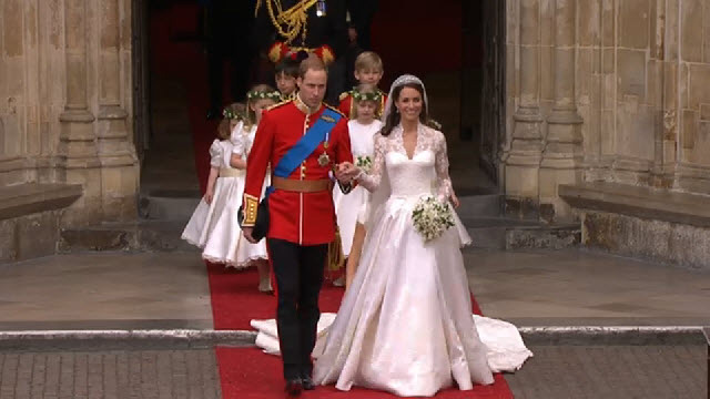 The Duke of Cambridge leading his wife the Duchess of Cambridge out of 