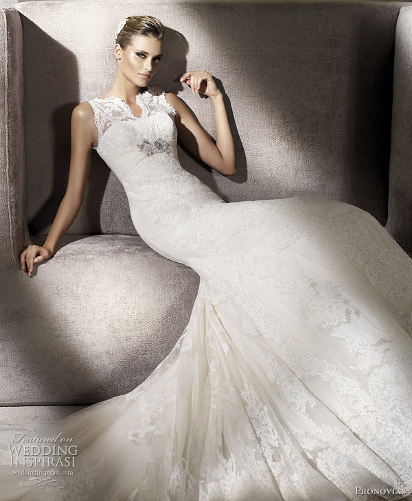 Closeup of Palace wedding dress featuring pretty lace top with split 