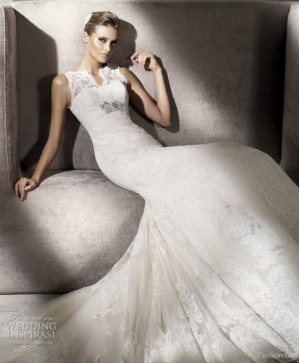 Closeup of Palace wedding dress featuring pretty lace top with split Closeup of Palace wedding dress featuring pretty lace top with split