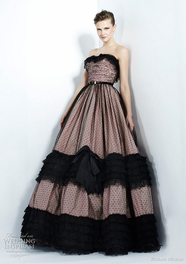Black dotted netting over pale pink strapless dress
