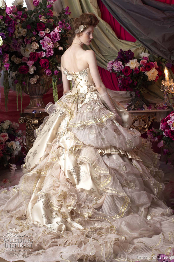 Above regal pink wedding dress with gold butterfly accents