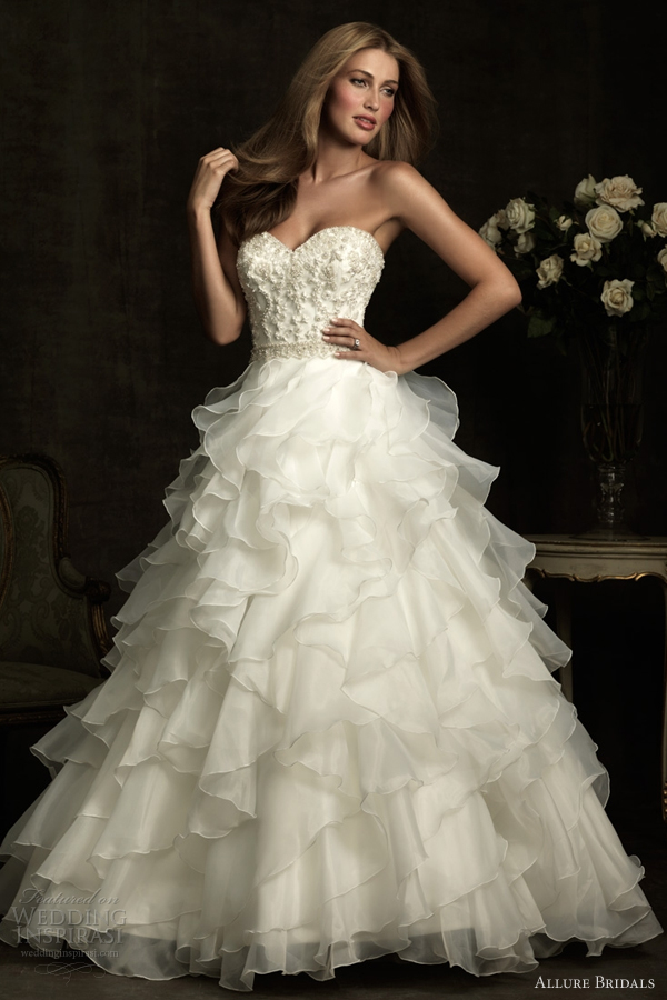 Aline wedding dress with fitted strapless sweetheart bodice that is ruched 