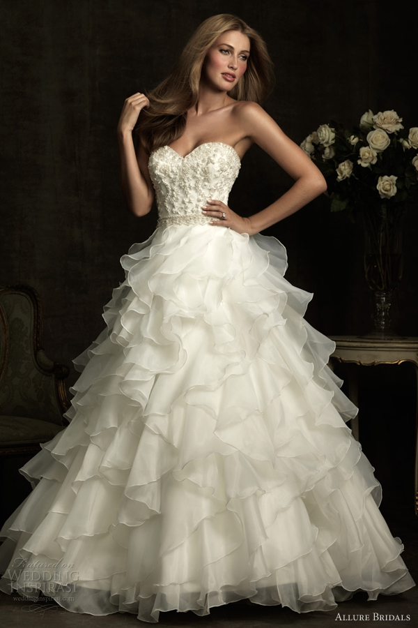 Aline wedding dress with fitted strapless sweetheart bodice that is ruched