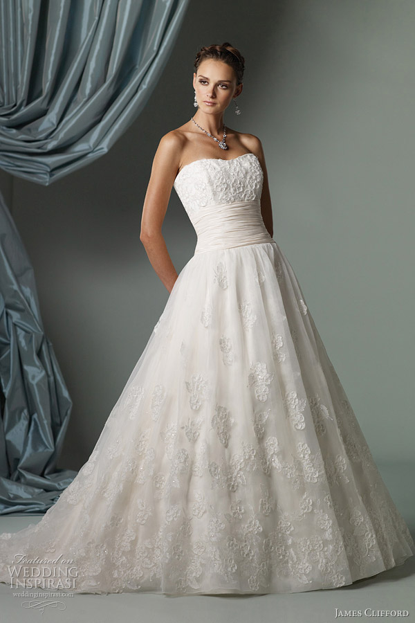 Below strapless ball gown with lace bodice featuring ribbon trimmed flower 