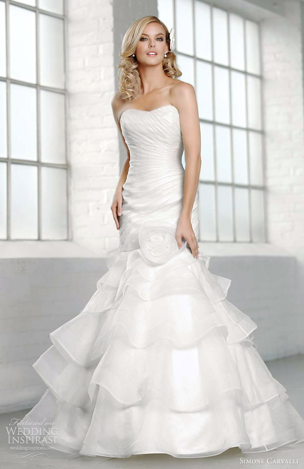 Corina gown with sweetheart neckline and skirt adorned with ostrich feathers