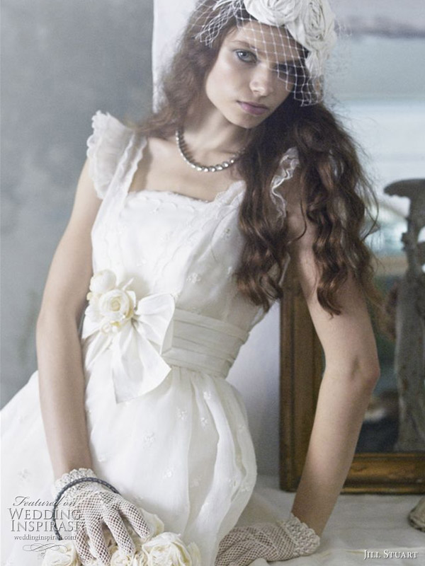 Bird cage veil and ruffle sleeve wedding dress with bow detail and short net mesh gloves