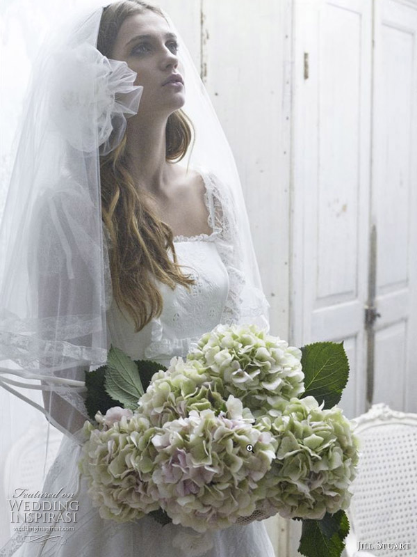 Flower veil and pretty feminine details on this romantic wedding dress by Jill Stuart