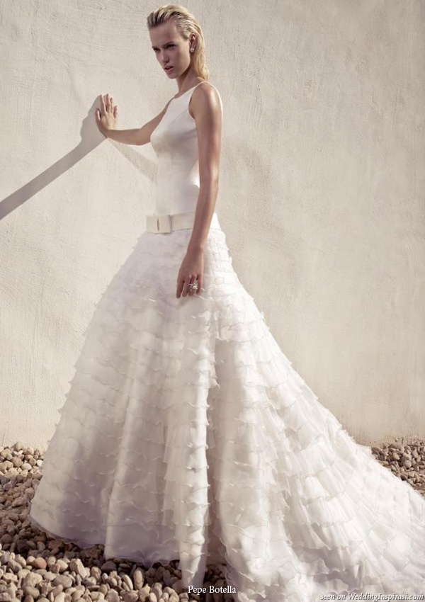 A gown Pepe Botello Novias collection: A-line wedding dress with mutitple tiers of ruffle