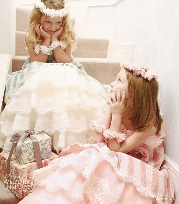 Pretty flower girls in white, green and pink with gifts wrapped with ribbons Pretty flower girls in white, green and pink with gifts wrapped with ribbons