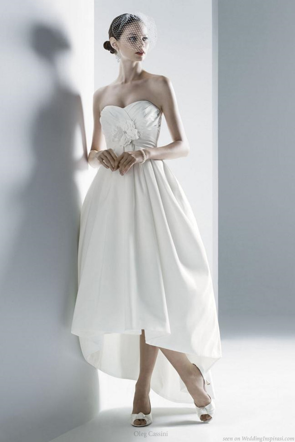 Wedding dress with asymmertric hem, short in front, long at the back, by Oleg Cassini