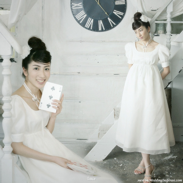Alice in LUCE land cute wedding dress themed photo shoot featuring big clocks and playing cards