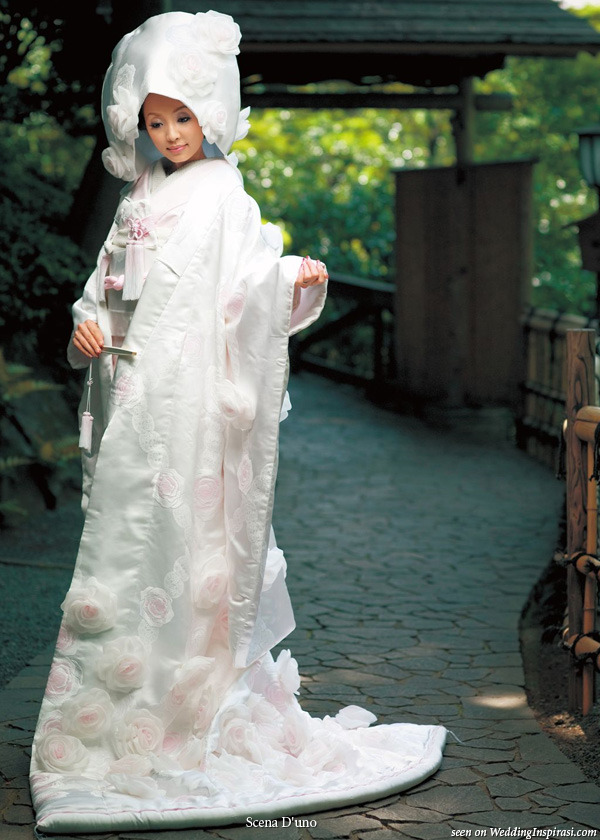 Japanese white wedding kimono with light pink flowers. Worn with ceremonial over coat with long train uchikake and head dress tsunokakushi 