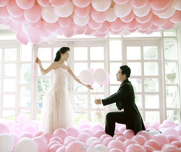 Fun wedding photo shoot with lots of pink, rose, cream and white balloons on the ceiling and floor by Korean bridal house Han Dressia