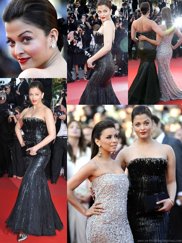 Cannes 2010 red carpet premiere screening of Tournee - Bollywood actress Aishwarya Rai in Armani Prive and Ferragamo black satin clutch poses with Desperate Housewife actress Eva Longoria in Naeem Khan