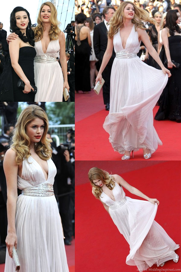 Dutch model Doutzen Kroes in a white grecian dress designed by Roberto Cavalli at Cannes 2010