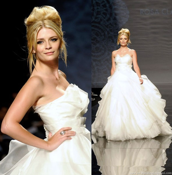 Mischa Barton poses as a bride a Barcelona Bridal Week for Spanish label Rosa Clara, donning a full-skirted strapless dress in pleated organza