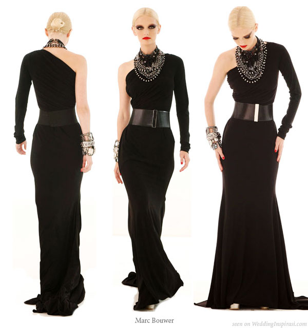 One shoulder sleeve toga dress in black worn with wide belt designed by Marc Bouwer