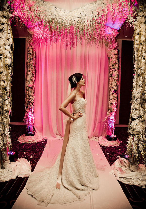 Chuppahs, dripping with crystal and garlands of orchids, by Grande Affaires showed a new trend of a criss-cross designed ceiling. This criss-cross design gave a sloped effect of a 12- foot ceiling raining crystals and orchids over the bride and groom. 