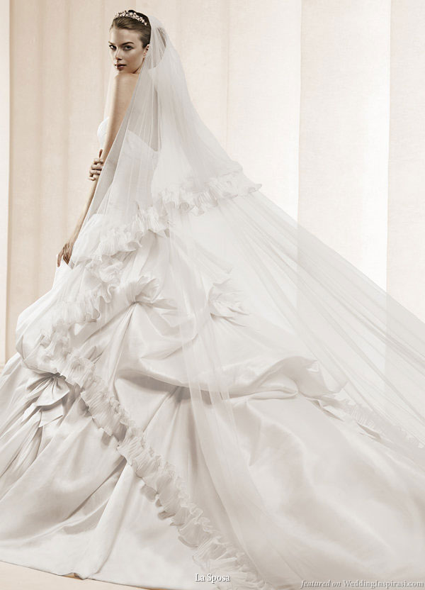 La Sposa 2011 Bridal Gown Collection -- Dedalo ballgown strapless wedding dress with pickup skirt worn with long chapel veil