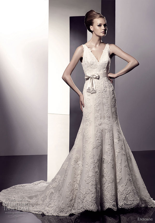 Enzoani 2010 bridal dress collection -  Ebony,  V-neck mermaid silhouette lace wedding gown with satin bow and jewelled detail on natural waist; semi-cathedral train.