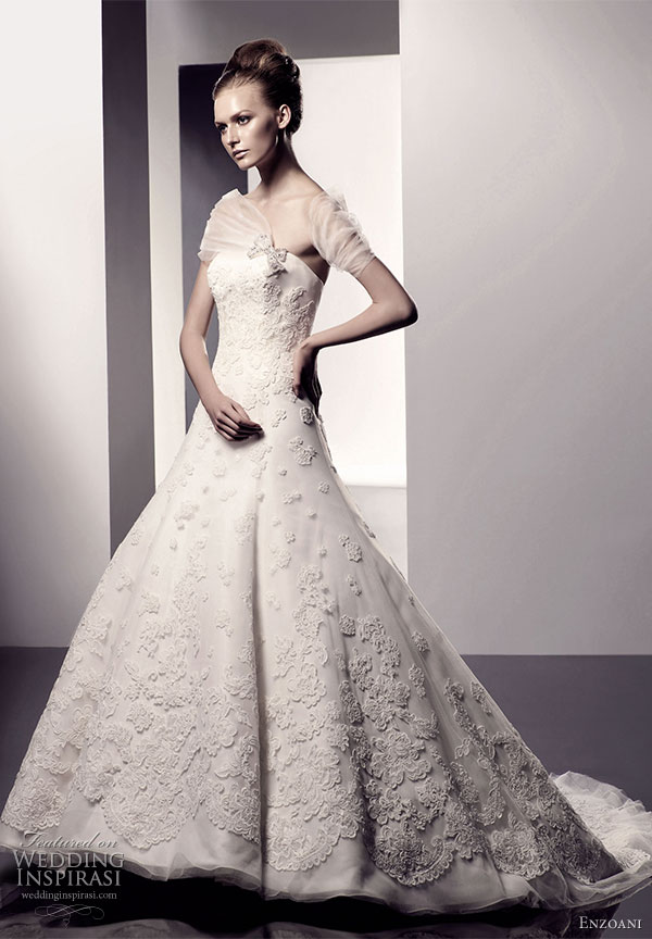 Evanna wedding dress A-line silhouette with strapless soft sweetheart neckline, tulle overlay with scalloped lace embroidered floral detail; semi-cathedral train. From Enzoani 2010 bridal gown collection