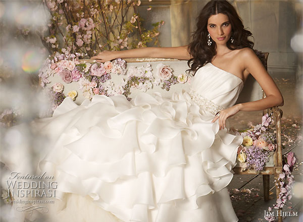 Jim Hjelm 2010 Fall wedding dress collection - Ivory Silk Satin Faced Organza Asymmetrical draped ruffle bridal gown, strapless   elongated bodice with ruffle detail, crystal trim at natural waist, chapel train.