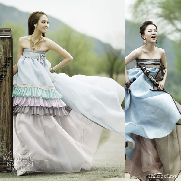 Traditional korean dress given an update using unusual materials such as chiffon, in lighter colors and incorporating elements such as ruffles and tiered skirt