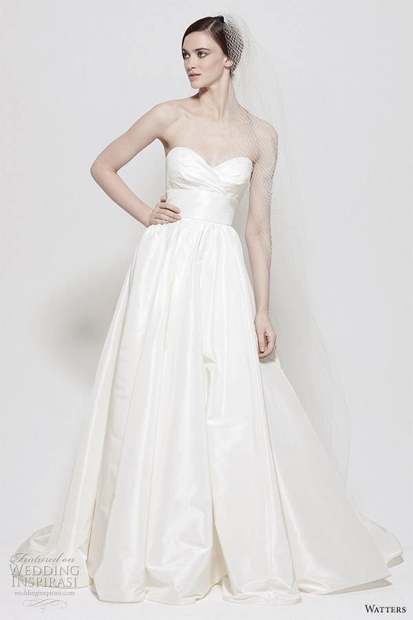 Watters wedding gown from the Spring 2011 collection - Gobi White Silk Taffeta strapless gown with sweetheart neckline, empire band with flower pin and full skirt. Chapel Train.