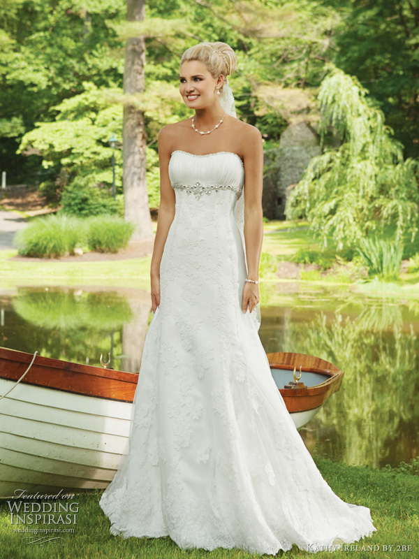 2be Bridals Spring 2011 Kathy Ireland Weddings collection - style E231129 - Strapless illusion and lace A-line gown, softly curved neckline trimmed with hand-  beading, finely ruched bust line, beaded Empire waistline, skirt adorned with lace appliqués and chapel length train. Removable straps included.