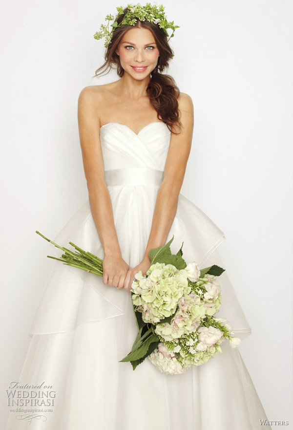 2011 Watters bridal collection - Swan wedding dress - White silk organza sculpted strapless gown with layered cascading over skirt and snow double faced ribbon at waist. Dress features hand rolled white silk organza flower corsage at small of the back and 60" Sweep train. The ribbon is available in Gardenia, Vanilla Bean, and Seaside. 2011 Watters bridal collection - Swan wedding dress: White silk organza sculpted strapless gown with layered cascading over skirt and snow double faced ribbon at waist. Dress features hand rolled white silk organza flower corsage at small of the back and 60" Sweep train. The ribbon is available in Gardenia, Vanilla Bean, and Seaside.