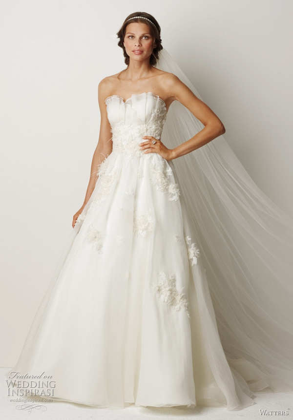 2011 wedding dress from Watters fall bridal collection - Cairns- Ivory washed silk organza ball gown with sheer sweet crumb neckline, beaded and embroidered ivory lace midriffs and traversing skirt. Lace motifs are embellished with crystals, organza and ostrich feathers, and features a 69 inch Chapel train.