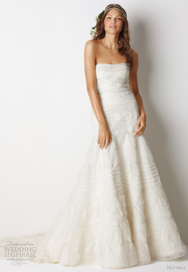 Watters Fall 2011 bridal collection relaxed glamour wedding dress  -  Mackay Ivory silk organza strapless, fluted silhouette gown with pin tucks, beading and cotton lace bands traversing the body of the dress and 72" chapel train.