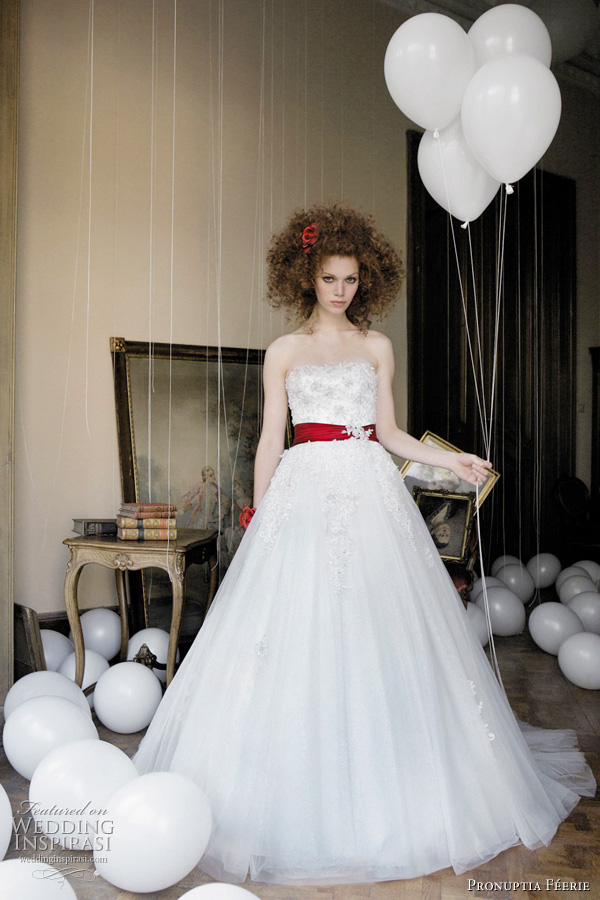 Pronuptia 2011 bridal gown collection  - Etonnante féérie white wedding dress with red belt - Pearled bustier dress with coloured belt to emphasise the waist. All tulle skirt with lace cascade providing an enchanting look with its fine pearls